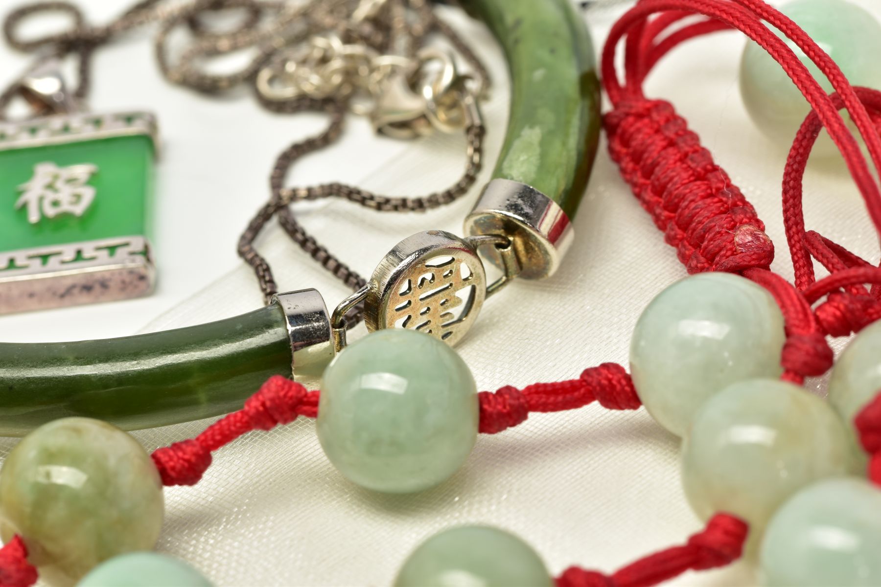 A SELECTION OF JADE AND NEPHRITE JEWELLERY, to include a beaded assessed as jade adjustable bracelet - Image 3 of 4