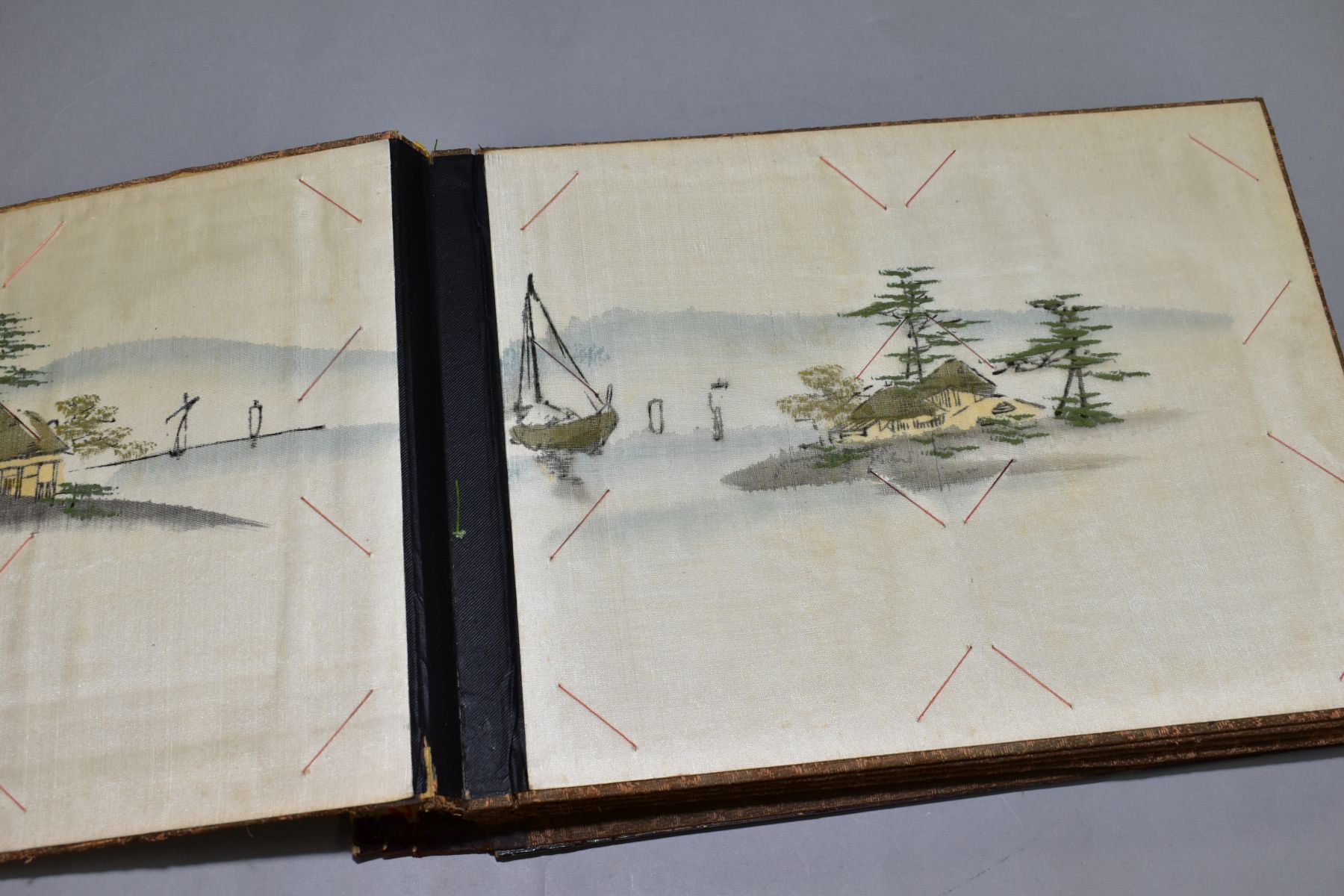 A SHIBYAMA LAQUERED PHOTOGRAPH/POSTCARD ALBUM, containing 20 leaves of painted silk illustrations, - Image 4 of 8