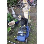 A CHALLENGE XTREME PETROL LAWN MOWER with a 3.5hp four stroke engine and grass collection bag (