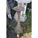 AN AESTHETIC MOVEMENT STYLE CAST IRON TABLE BASE with pyramid stud detail down to central column,