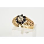 A 9CT GOLD SAPPHIRE AND DIAMOND CLUSTER RING, the tiered cluster with a central illusion set