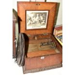 A MAHOGANY CASED MUSICAL SYMPHONION with six discs, mechanism winds and functions but requires