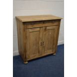 A 20TH CENTURY PINE PANELLED TWO DOOR CABINET with a single drawer, width 110cm x depth 52cm x