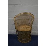 A LOW WICKER PEACOCK CHAIR (sd)