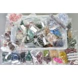 A LARGE SELECTION OF BEADS, a variety of small rough nugget beads in gemstones such as tourmaline,