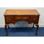 A REPRODUCTION BURR WALNUT AND BANDED DESK/DRESSING TABLE, with two deep drawers flanking a small
