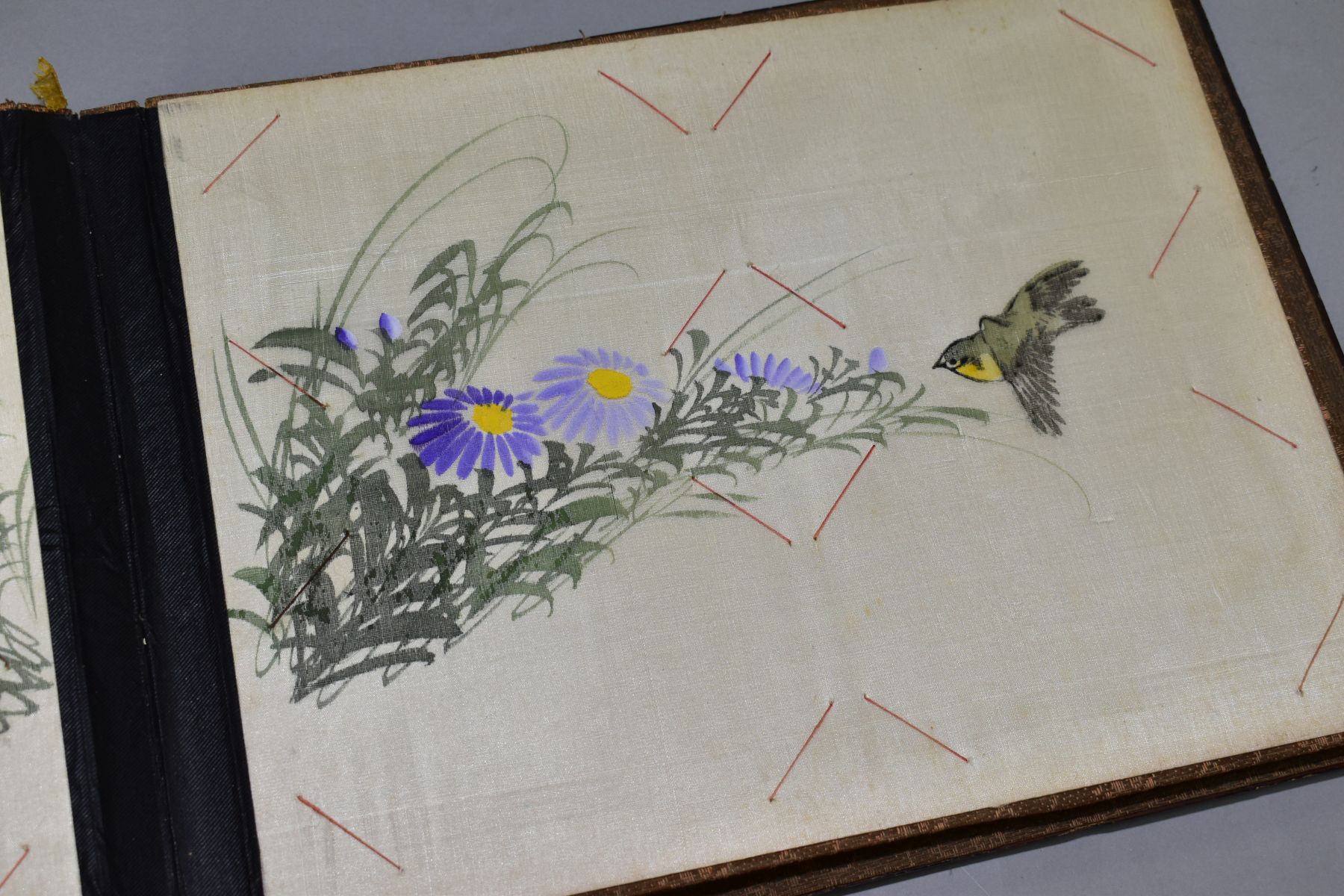 A SHIBYAMA LAQUERED PHOTOGRAPH/POSTCARD ALBUM, containing 20 leaves of painted silk illustrations, - Image 7 of 8
