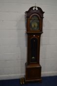 AN EARLY 20TH CENTURY MAHOGANY AND INLAID LONGCASE CLOCK, the hood with a brass finial, arched glass