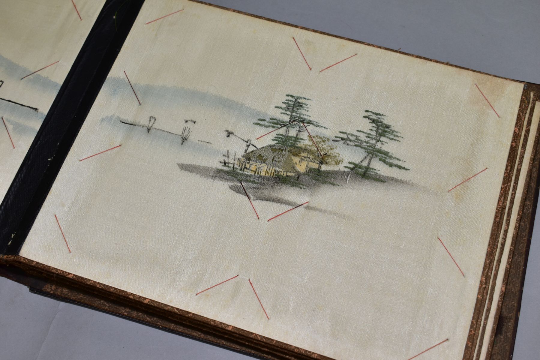 A SHIBYAMA LAQUERED PHOTOGRAPH/POSTCARD ALBUM, containing 20 leaves of painted silk illustrations, - Image 5 of 8