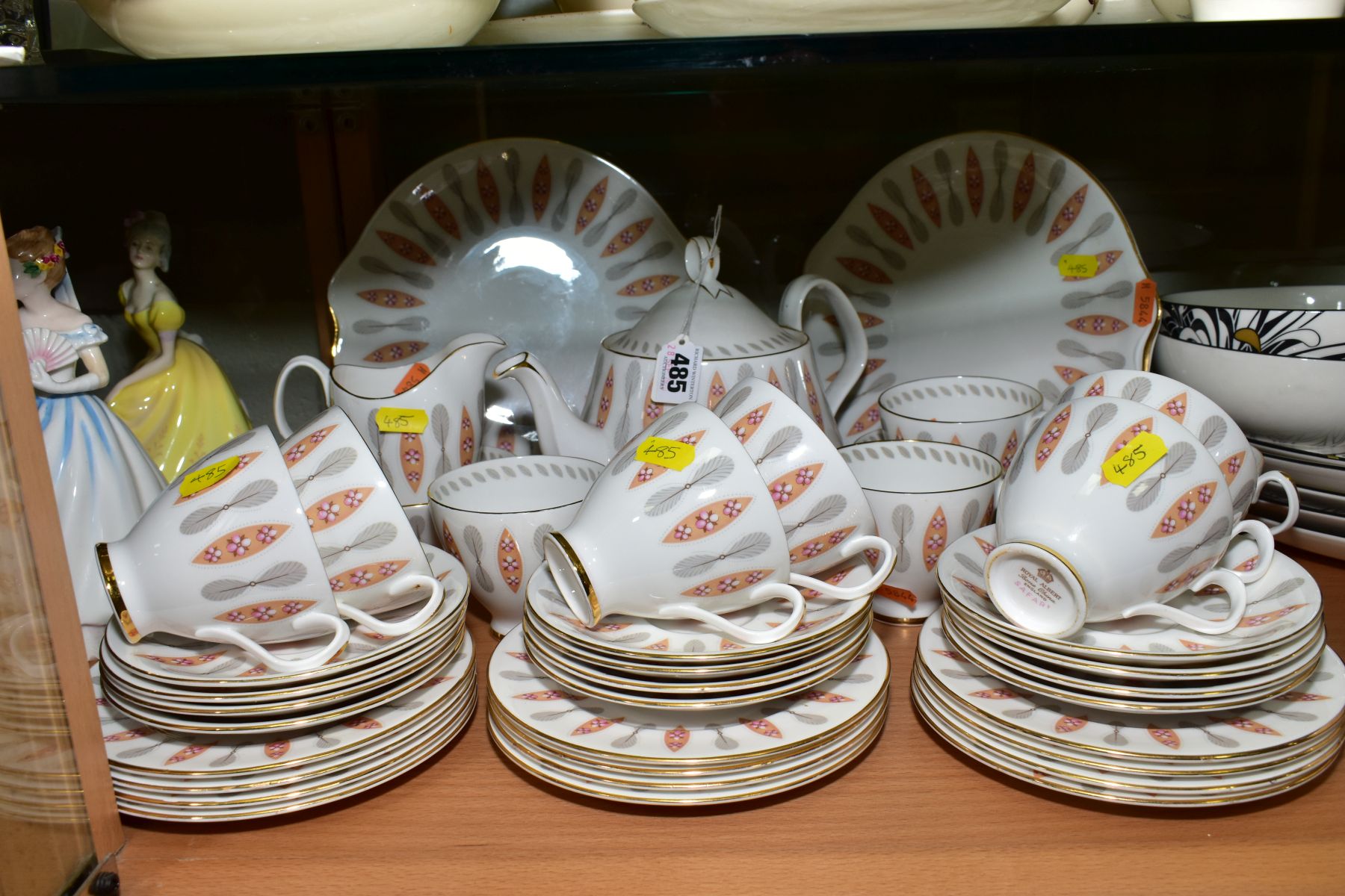 A ROYAL ALBERT 'SAFARI' TEASET, comprising teapot, two cake/sandwich plates, milk jug, two sugar