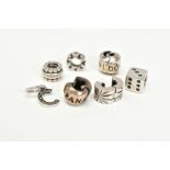 A COLLECTION OF SIX PANDORA CHARMS, to include a dice, letter C initial set with colourless paste,