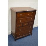 A TALL STAG MINSTRAL CHEST OF THREE SHORT AND FOUR LONG DRAWERS, width 82cm x depth 46cm x height