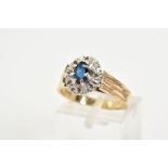 A 9CT GOLD SAPPHIRE AND DIAMOND RING, of a tiered cluster design with a central claw set oval cut