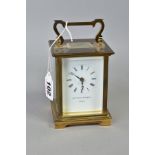 A MATTHEW NORMAN OF LONDON BRASS CASED CARRIAGE CLOCK, white enamel dial with Roman numerals, back