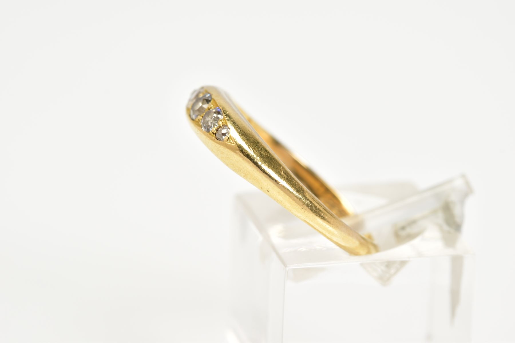 A YELLOW METAL DIAMOND BOAT RING, designed with five graduated diamonds with a central round - Image 2 of 3