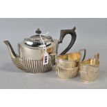 A LATE VICTORIAN SILVER THREE PIECE BACHELORS TEA SET, of oval form, stop reeded decoration,