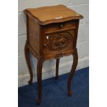 AN EARLY 20TH CENTURY CARVED WALNUT POT CUPBOARD, with a single drawer, ceramic interior, on