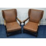 A PAIR OF MID 20TH CENTURY OAK FRAMED FIRESIDE CHAIRS (sd)