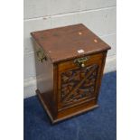 A LATE 19TH/EARLY 20TH CENTURY CARVED OAK PURDONIUM with a fall front door, width 37cm x depth