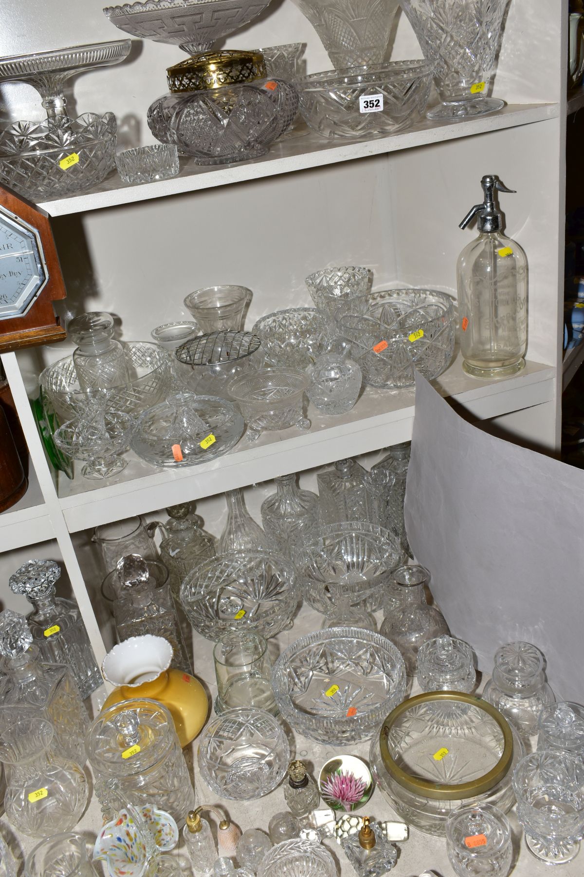 A MISCELLANEOUS COLLECTION OF GLASSWARE, mostly cut glass including bowls, decanters, biscuit