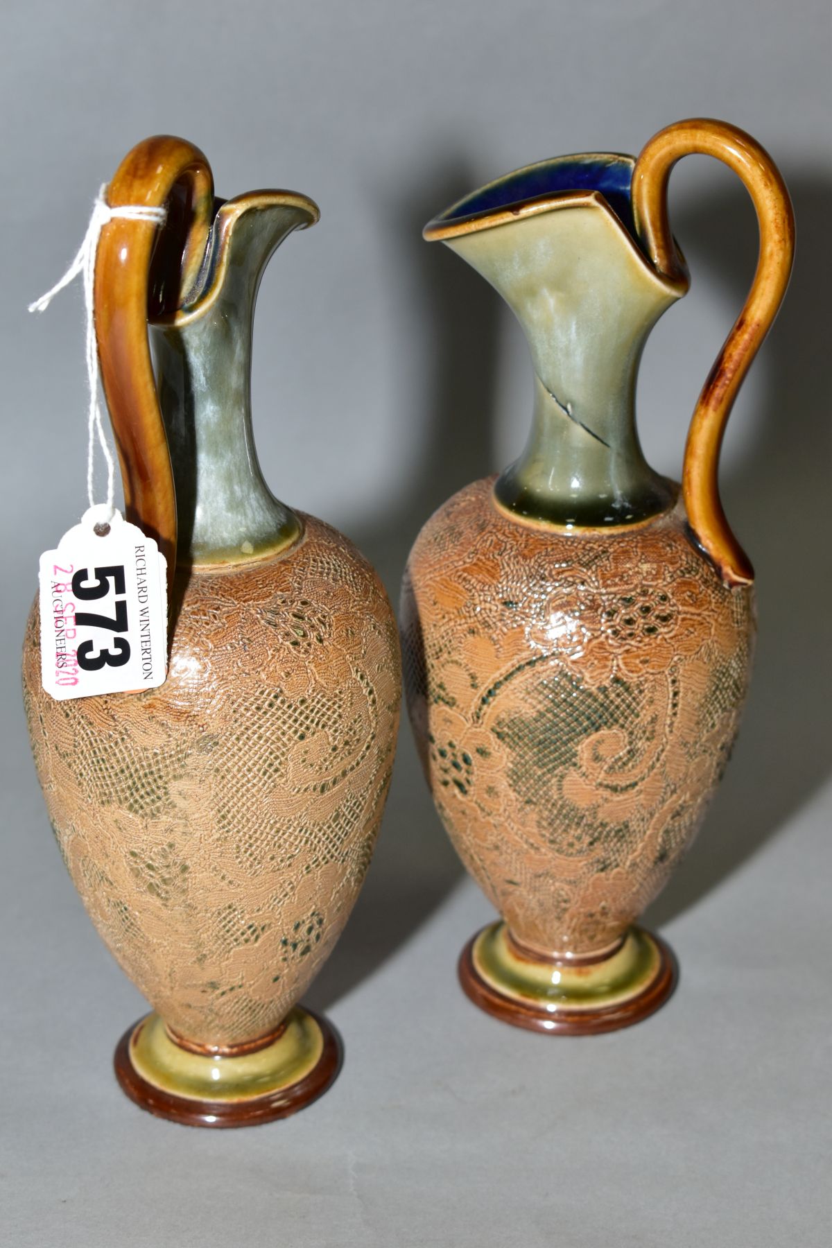 A PAIR OF ROYAL DOULTON STONEWARE EWERS, blue and brown glazed handle and spout, impressed lace - Bild 2 aus 5