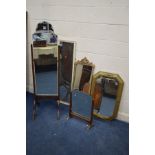 AN OAK FRAMED CHEVEL MIRROR, together with a gilt painted wall mirror and three various other