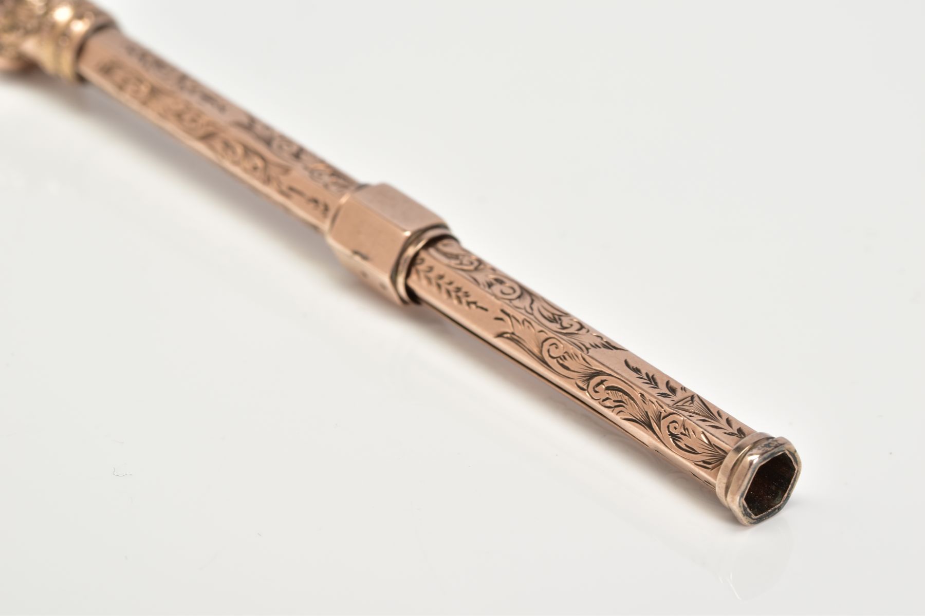 A YELLOW METAL RETRACTABLE PENCIL, designed with a floral engraved pattern to the body of the - Image 3 of 5