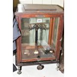 A SET OF PRECISION WEIGHING SCALES BY F SARTORIUS OF GOTTINGEN in a glazed wooden case