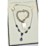 A LAPIS LAZULI NECKLACE AND WHITE METAL BRACELET, the necklace designed with a panel of six oval cut