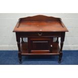 A MODERN HARDWOOD WASHSTAND with raised back and sides, dummy drawer and a single cupboard door,