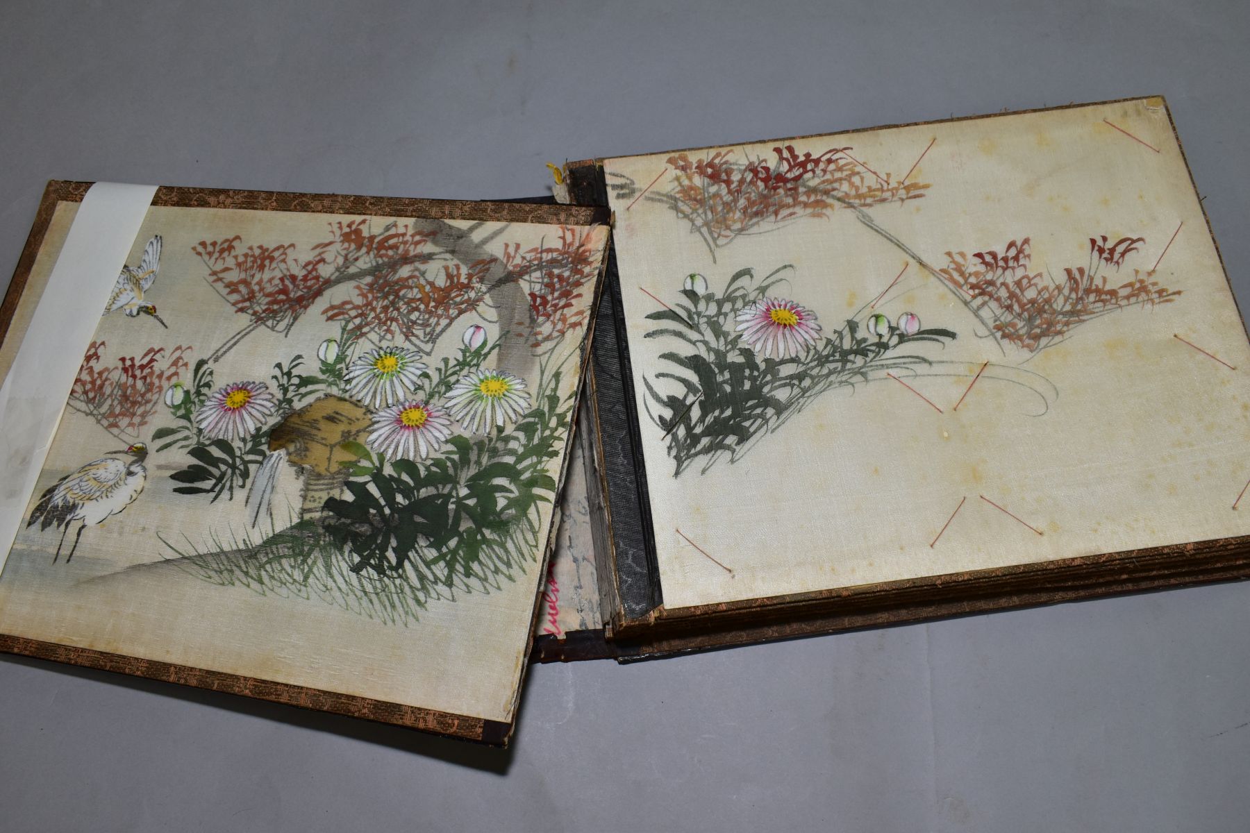 A SHIBYAMA LAQUERED PHOTOGRAPH/POSTCARD ALBUM, containing 20 leaves of painted silk illustrations, - Image 3 of 8