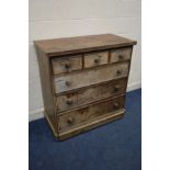 A DISTRESSED WALNUT CHEST OF THREE SHORT OVER THREE LONG DRAWERS, with turned handles, width 106cm x