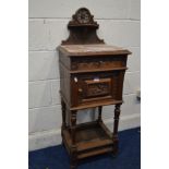 AN EARLY 20TH CENTURY CARVED OAK BRETON POT CUPBOARD, with a veined marble top, and single drawer
