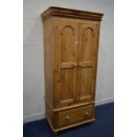 A LATE 20TH CENTURY VICTORIAN STYLE PINE TWO DOOR WARDROBE, with a single drawer, width 92cm x depth