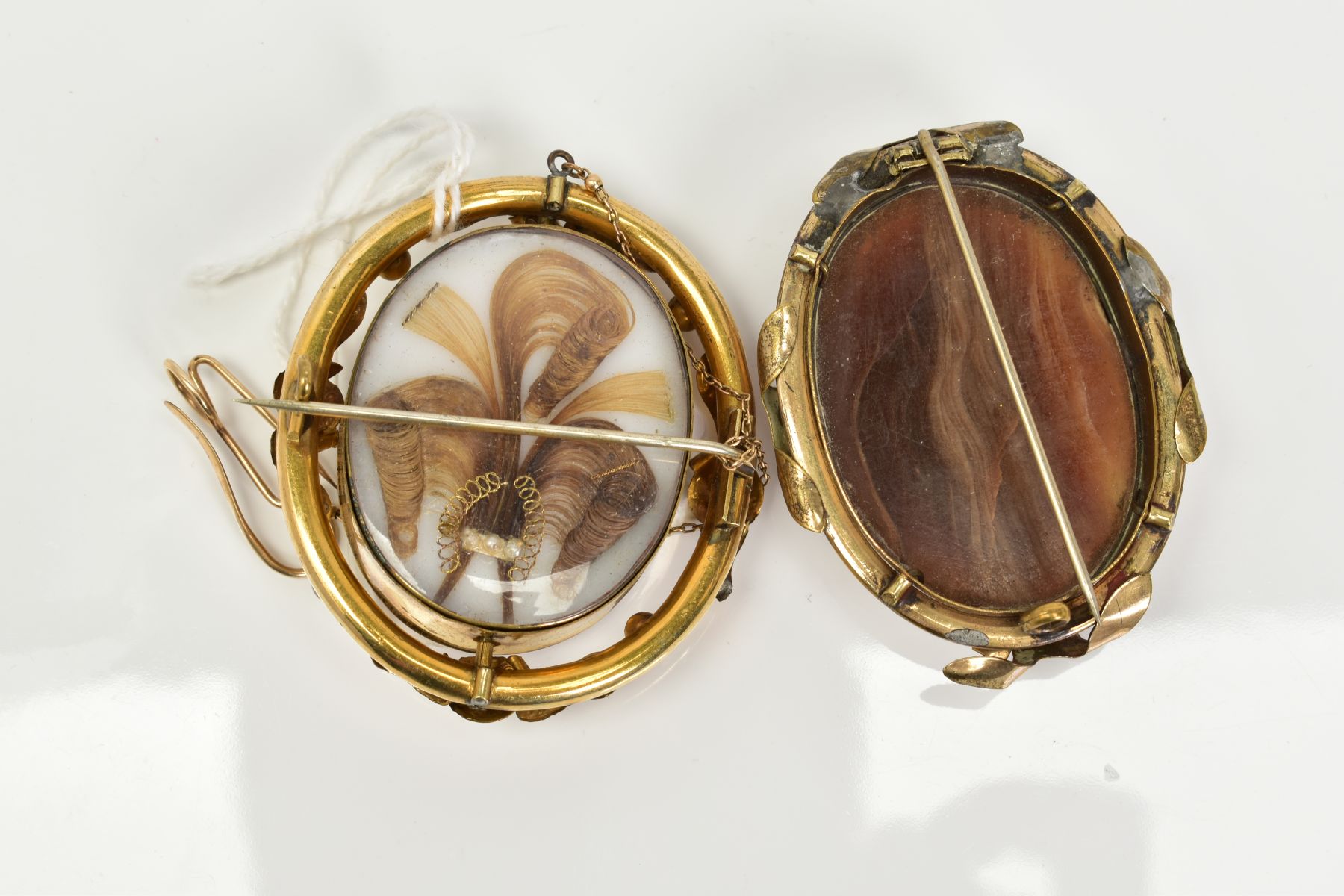 TWO YELLOW METAL BROOCHES, to include a cameo swivel memorial brooch, the cameo depicting the - Image 2 of 2