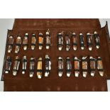 A FOLD OVER CASE CONTAINING A NUMBER OF PENKNIVES, all mounted and in good condition twenty four