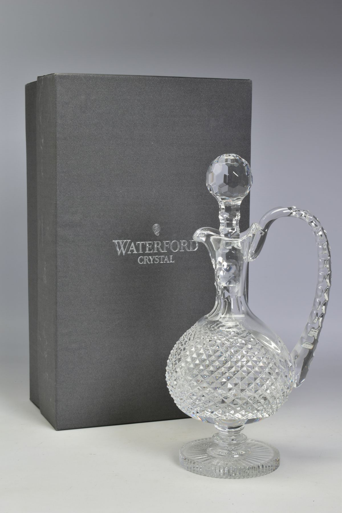 A BOXED WATERFORD CRYSTAL ALANA CLARET JUG, stamped to base, height 31.5cm (crack to handle)