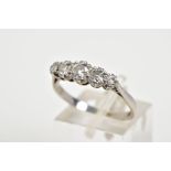 A PLATINIUM FIVE STONE DIAMOND RING, designed with five claw set graduated old cut diamonds, tapered