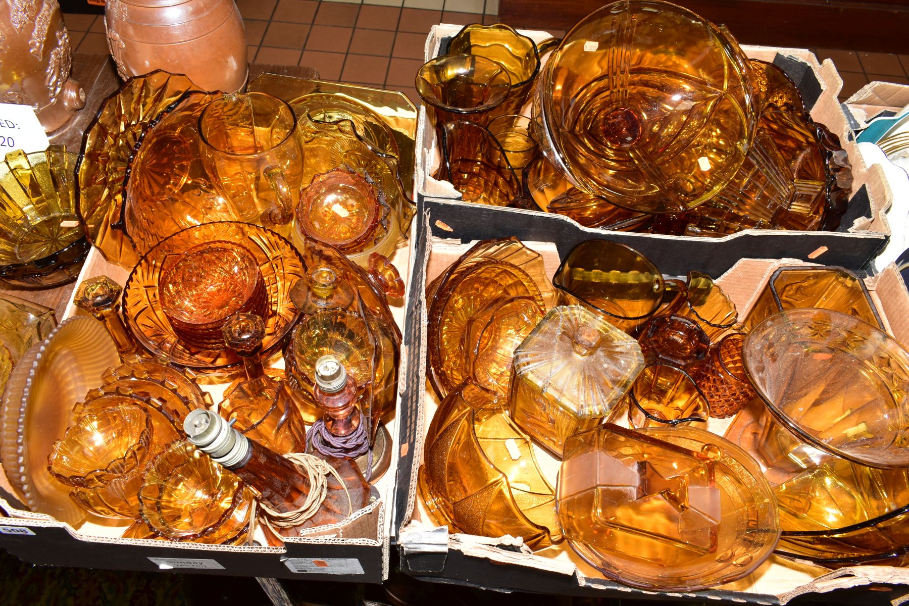 THREE BOXES OF PRESS MOULDED AMBER GLASS to include bowls, storage containers, candlesticks, water