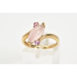 A 9CT GOLD ROSE QUARTZ RING, the asymmetrical marquise rose quartz cabochon with a crossover