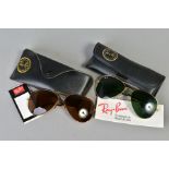 TWO PAIRS OF RAY-BAN SUNGLASSES, both of aviator design, the first a yellow metal frame and dark
