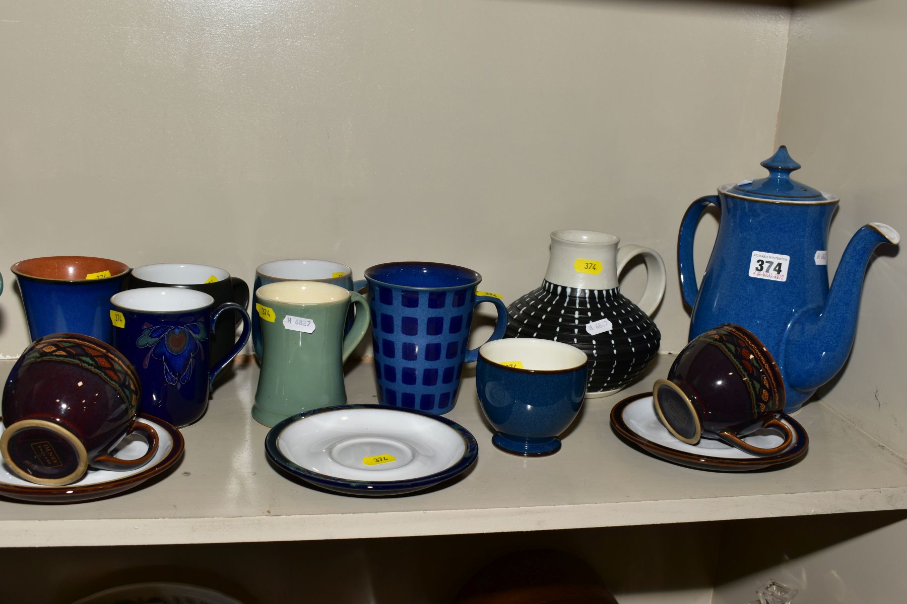 A COLLECTION OF DENBY POTTERY MUGS, TEA POTS, etc, various patterns and glazes, including a coffee