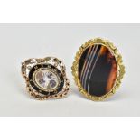 TWO VICTORIAN BROOCHES, to include a yellow metal mourning brooch, featuring an oval glass panel,