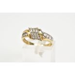 A 9CT GOLD DIAMOND RING, designed with an asymmetrical panel set with round brilliant cut