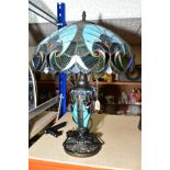 A TIFFANY STYLE TABLE LAMP by Minister Stylish Living, the baluster shaped body has a twin bulb