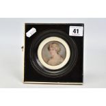 A MINIATURE PORTRAIT WITHIN A WOODEN FRAME, the black wooden frame with an outside ivory panel