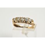 AN EARLY 20TH CENTURY FIVE STONE DIAMOND RING, graduated diamonds four old cut and one round