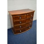 A VICTORIAN MAHOGANY BOW FRONT CHEST of two short and three long flame mahogany drawers with later