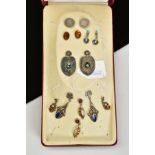 A BOX OF WHITE METAL EARRINGS, to include seven pairs of earrings such as a pair of oval amber