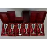 A SET OF SIX BOXED ELIZABETH II SILVER GOBLETS, gilt interiors, on conical stem to a circular